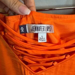 Jennifer Lopez Vibrant Orange Lace-Up Top sundress.
